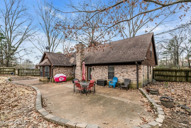 back of property featuring a patio