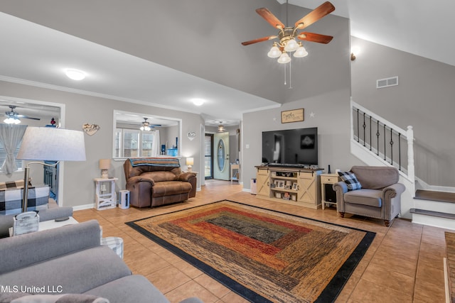 living room with high vaulted ceiling and tile patterned floors