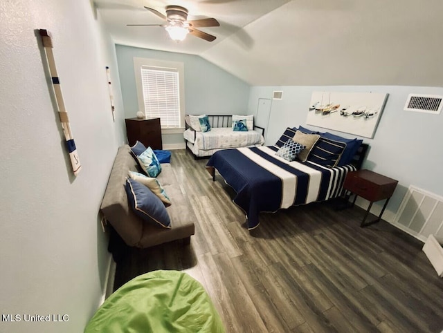 bedroom with ceiling fan, visible vents, vaulted ceiling, and wood finished floors