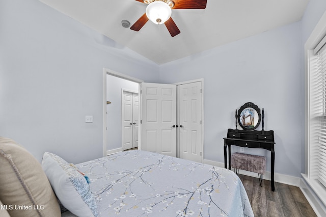 bedroom featuring ceiling fan, wood finished floors, and baseboards