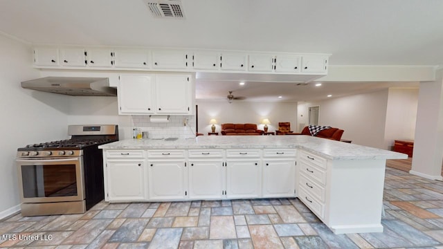 kitchen featuring kitchen peninsula, crown molding, ventilation hood, white cabinetry, and gas stove