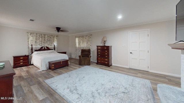 bedroom featuring crown molding and hardwood / wood-style floors