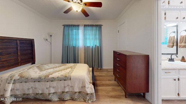 bedroom with ornamental molding, sink, light hardwood / wood-style flooring, and ceiling fan