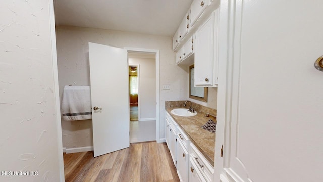 bathroom featuring vanity and wood-type flooring