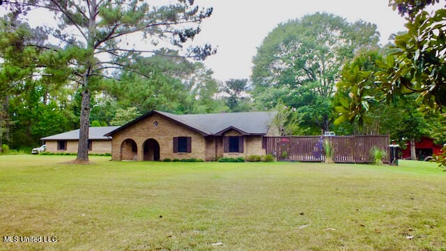 ranch-style house with a front lawn