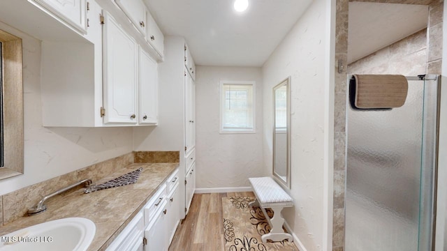 bathroom featuring vanity and hardwood / wood-style floors