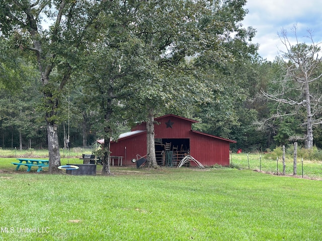 view of outbuilding featuring a lawn