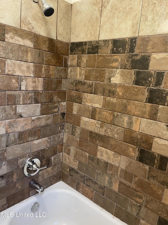 bathroom with shower / washtub combination