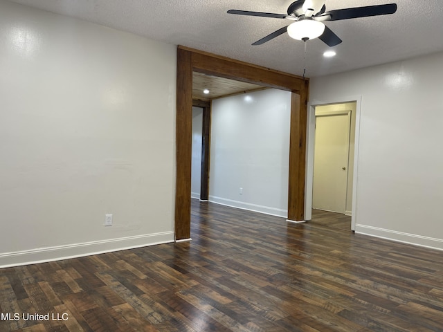 empty room featuring baseboards, ceiling fan, recessed lighting, dark wood-style floors, and a textured ceiling