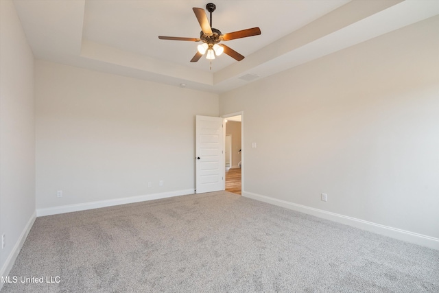 3786 Roland Dr, Southaven, MS 38672 - carpeted empty room with visible vents, baseboards, a ceiling fan, and a raised ceiling