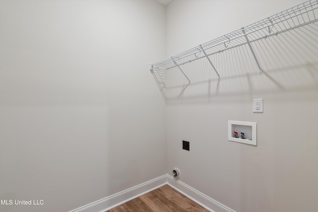 3786 Roland Dr, Southaven, MS 38672 - washroom featuring laundry area, hookup for a washing machine, wood finished floors, hookup for an electric dryer, and baseboards