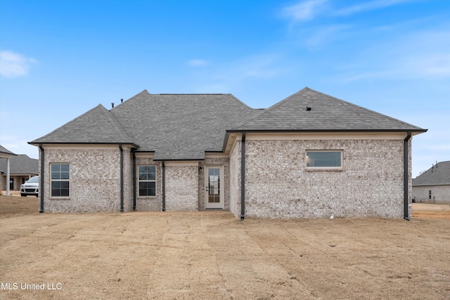 3786 Roland Dr, Southaven, MS 38672 - back of property featuring roof with shingles and brick siding