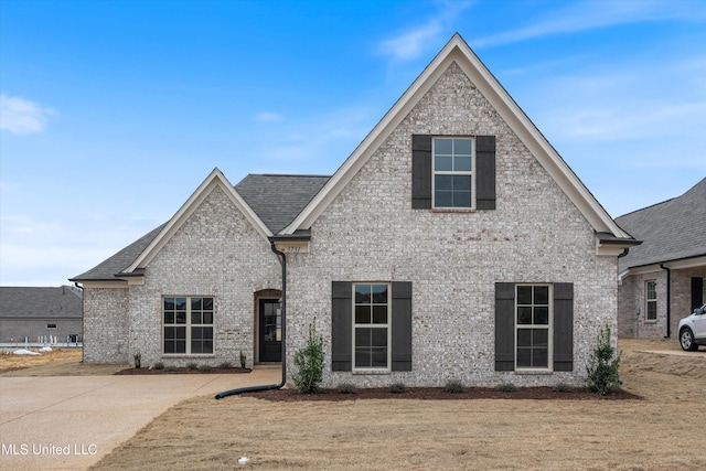 3786 Roland Dr, Southaven, MS 38672 - french country home featuring roof with shingles and brick siding