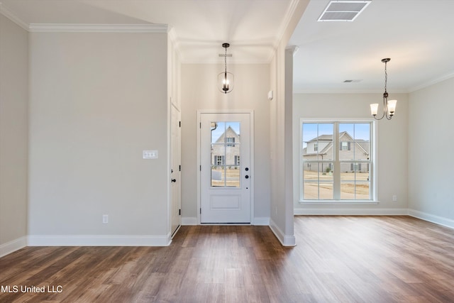 3786 Roland Dr, Southaven, MS 38672 - entrance foyer featuring crown molding, visible vents, a chandelier, and wood finished floors