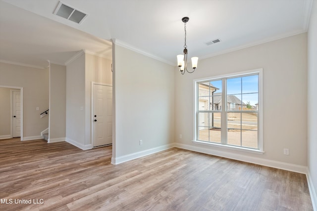 3786 Roland Dr, Southaven, MS 38672 - spare room with a chandelier, light wood finished floors, and visible vents