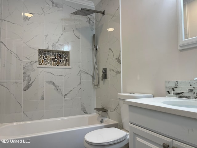 full bathroom featuring vanity, toilet, and tiled shower / bath