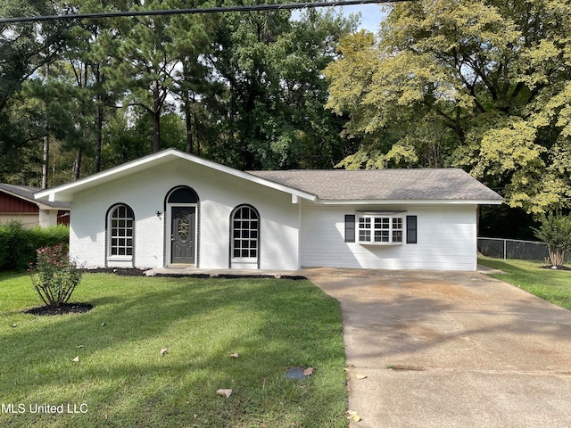 ranch-style home with a front yard