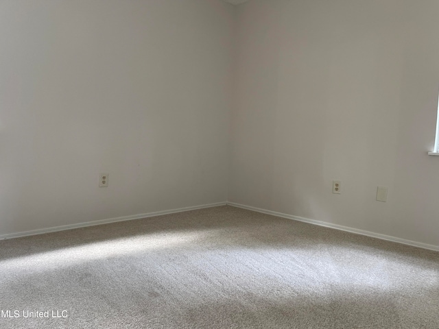 unfurnished room featuring carpet flooring