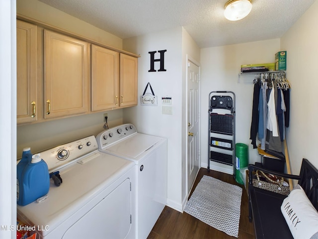 laundry area featuring a textured ceiling, baseboards, independent washer and dryer, cabinet space, and dark wood-style floors