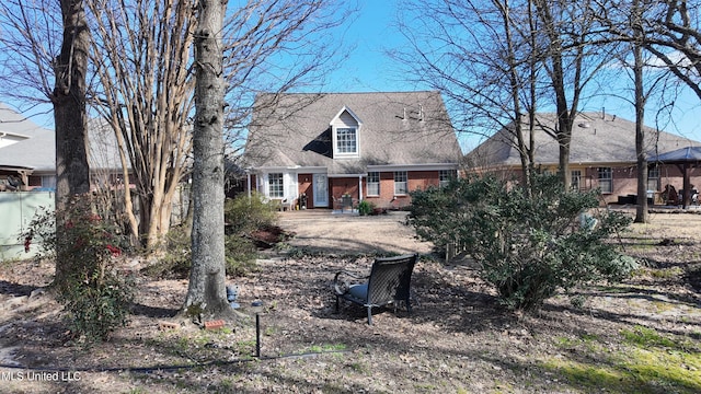 view of front of house featuring brick siding