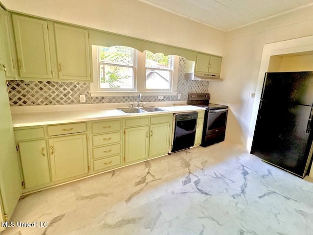 319 S 4th St, Mccomb, MS 39648 - kitchen with a sink, black appliances, tasteful backsplash, under cabinet range hood, and light countertops