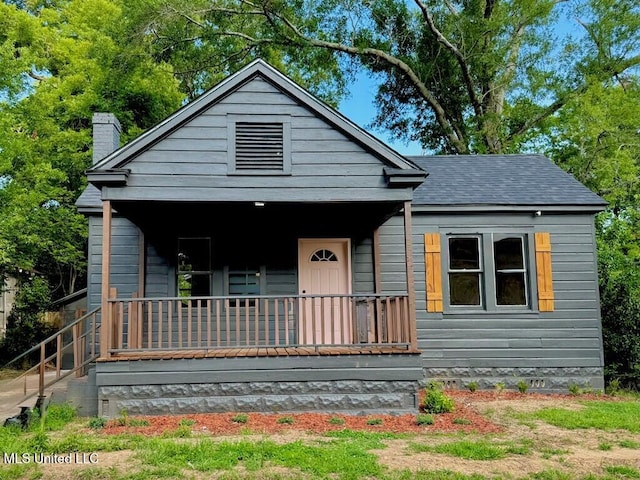 319 S 4th St, Mccomb, MS 39648 - view of front of property with a porch, a chimney, and crawl space