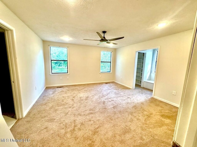 319 S 4th St, Mccomb, MS 39648 - spare room with light colored carpet, baseboards, and ceiling fan