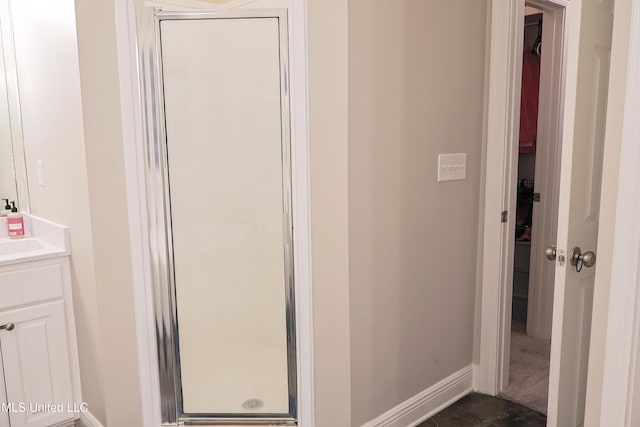 bathroom with vanity and walk in shower