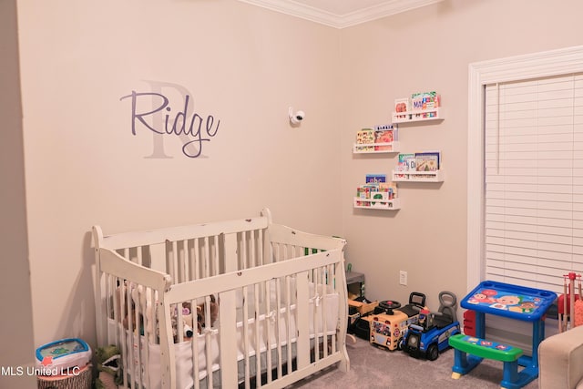 carpeted bedroom with crown molding and a crib