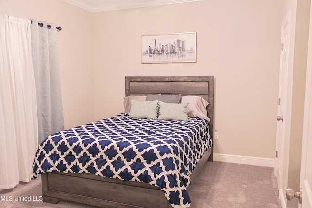 carpeted bedroom featuring crown molding