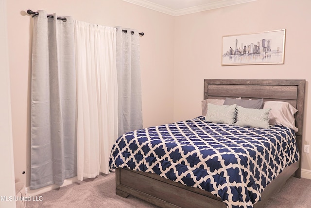 bedroom featuring crown molding and carpet