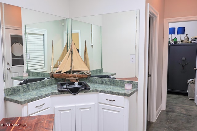 bathroom featuring tile patterned floors and vanity