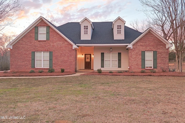 view of front of home with a yard