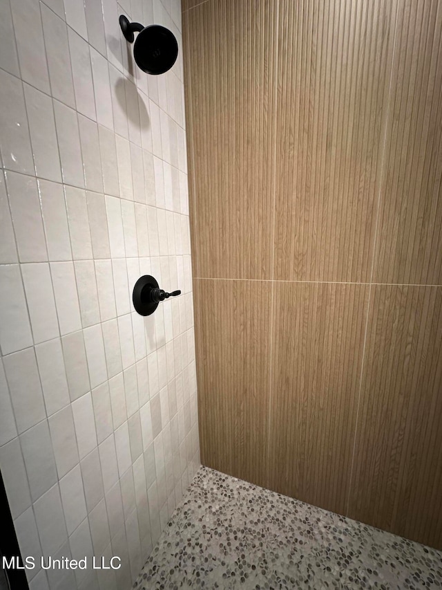 bathroom with tiled shower