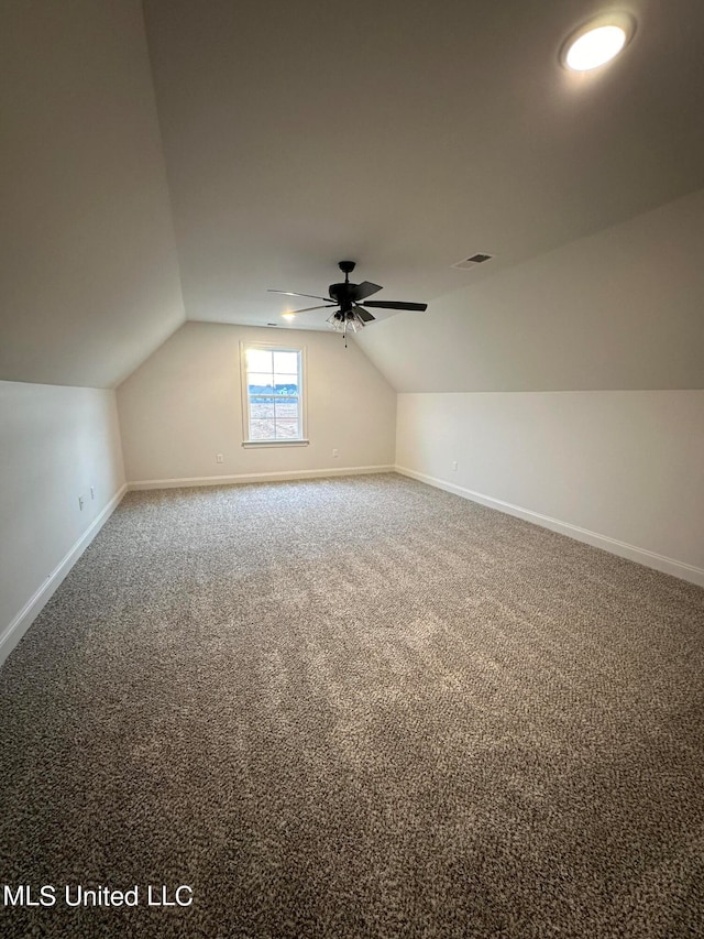 bonus room with carpet floors, ceiling fan, and lofted ceiling