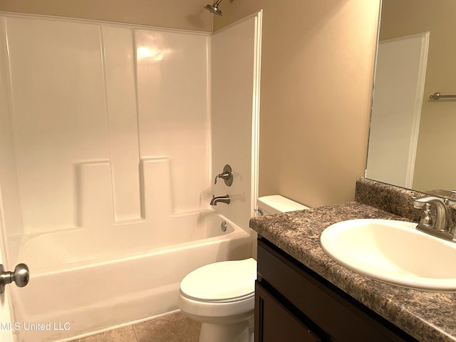 full bathroom with vanity, tile patterned flooring, toilet, and washtub / shower combination