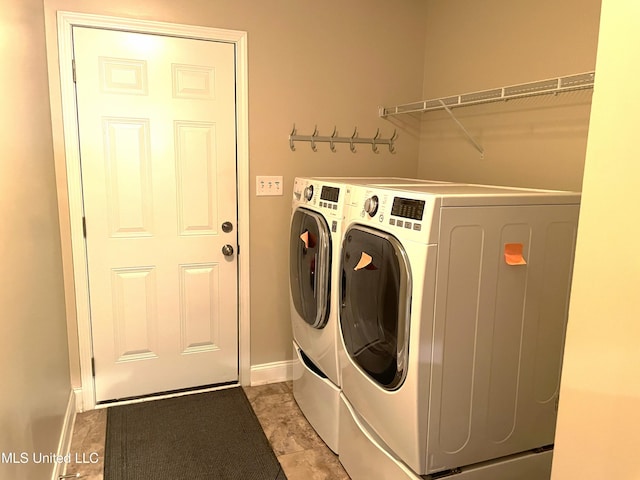 laundry room with washer and clothes dryer