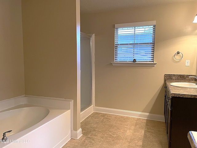 bathroom featuring vanity and plus walk in shower