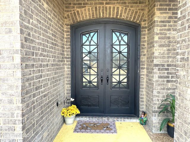 view of exterior entry featuring french doors