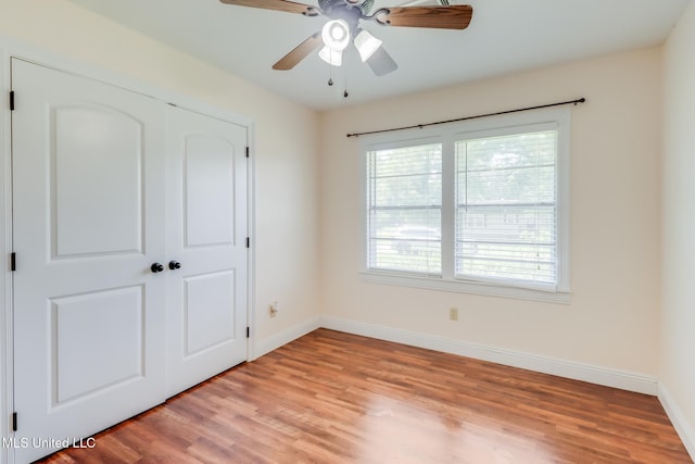603 James Ave, Wiggins, MS 39577 - unfurnished bedroom featuring light wood-type flooring, a closet, and ceiling fan