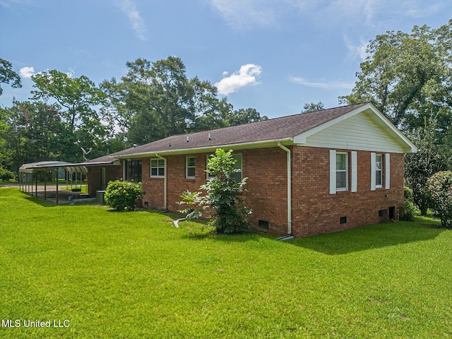 603 James Ave, Wiggins, MS 39577 - rear view of property with crawl space, a lawn, and brick siding