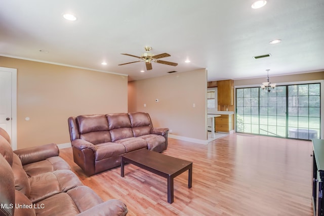 603 James Ave, Wiggins, MS 39577 - living area featuring recessed lighting, a chandelier, ceiling fan, crown molding, and light wood-style floors