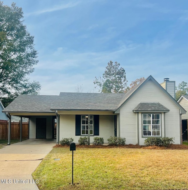 ranch-style house featuring a front yard and a carport