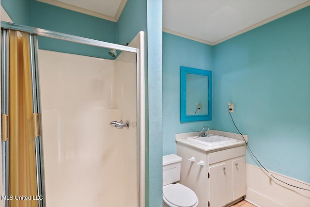 bathroom with vanity, toilet, and crown molding