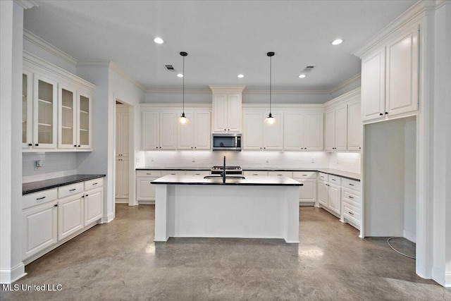 104 Glenwild Trl, Canton, MS 39046 - kitchen with stainless steel microwave, finished concrete floors, backsplash, white cabinets, and recessed lighting