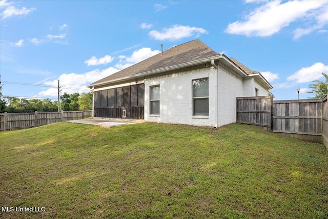 104 Glenwild Trl, Canton, MS 39046 - back of house featuring a fenced backyard, a sunroom, and stucco siding