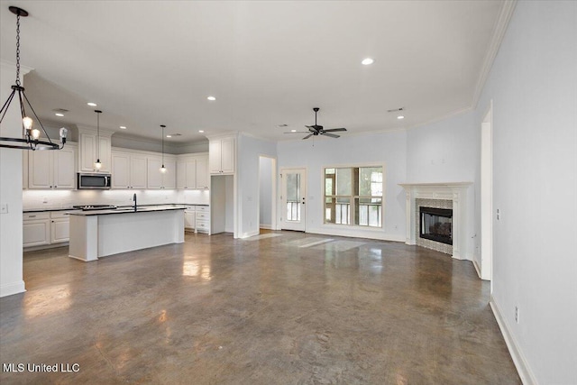 104 Glenwild Trl, Canton, MS 39046 - unfurnished living room featuring crown molding, concrete floors, recessed lighting, a glass covered fireplace, and a ceiling fan