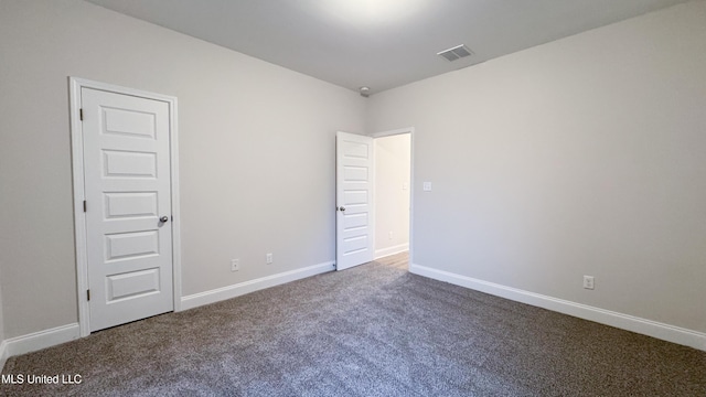 unfurnished room featuring carpet flooring