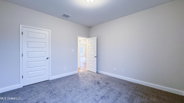 interior space with carpet floors and a closet