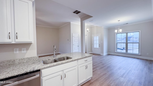 kitchen with dishwasher, white cabinetry, light stone countertops, and sink